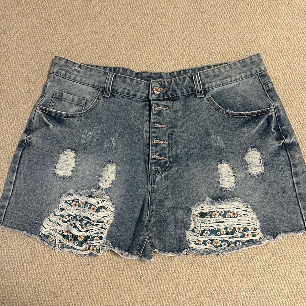 Distressed denim shorts